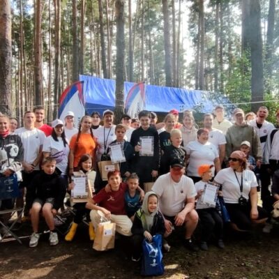 На озере Ильмень прошли соревнования по SUP-борду и катамаранам для слабовидящих и незрячих детей
